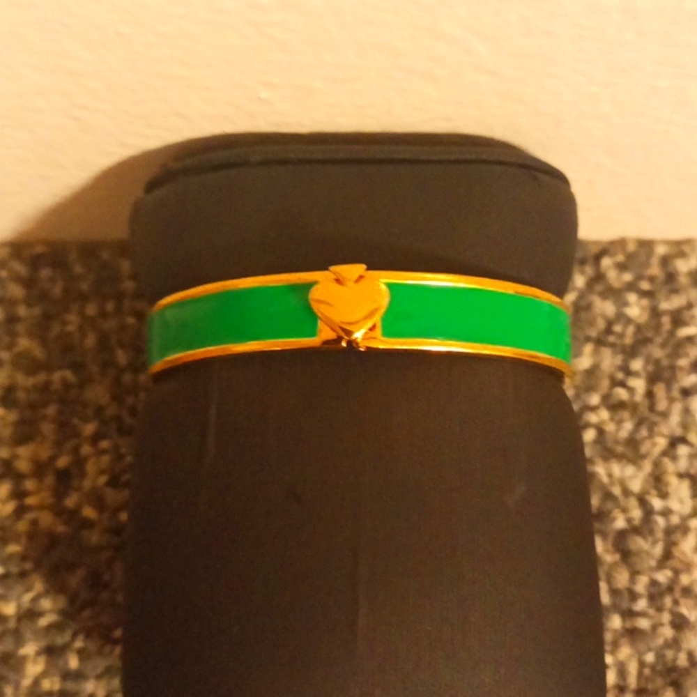 Kate Spade New York acrylic and gold tone green front clasp bangle brace…